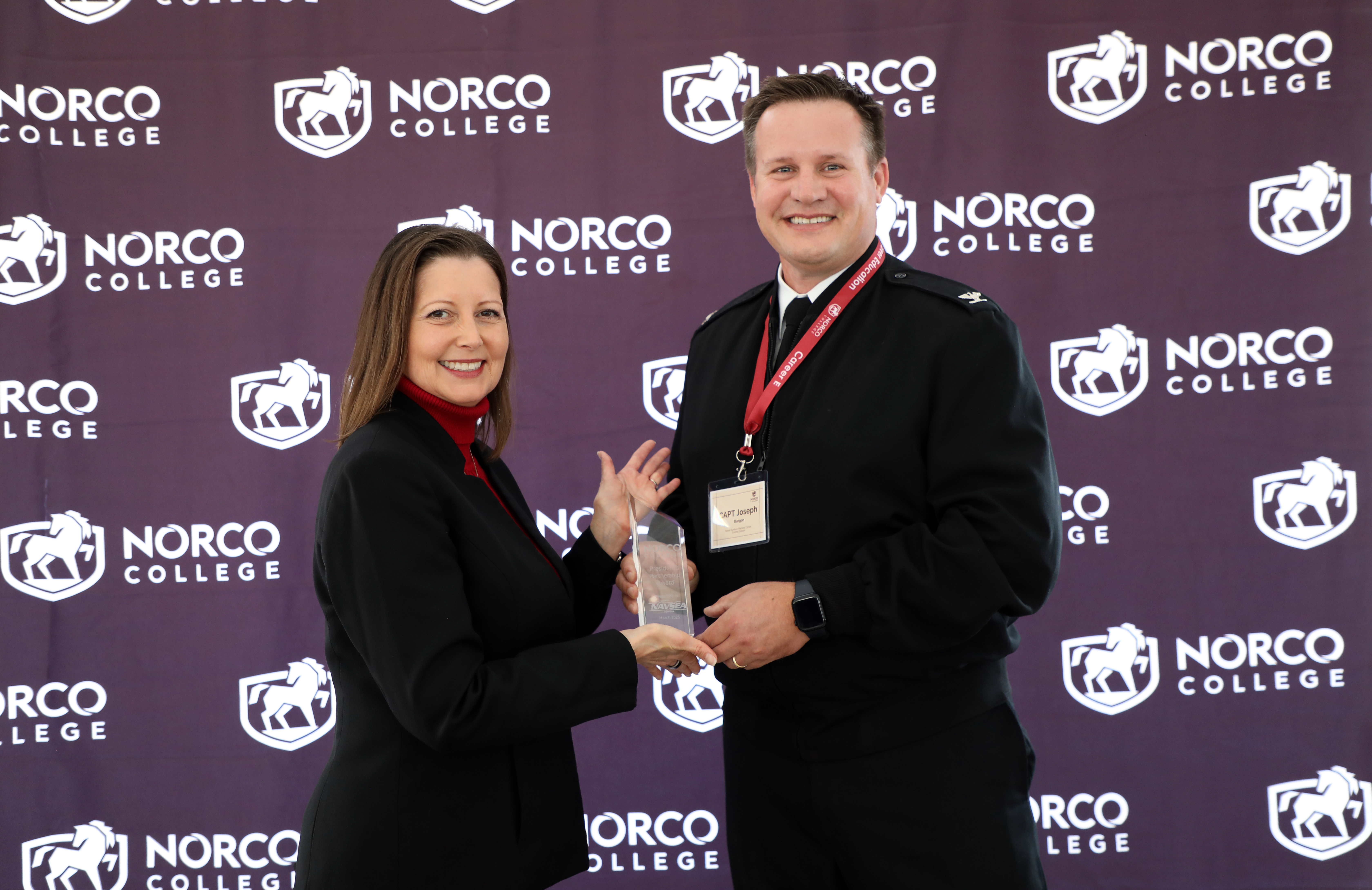 Awardee Captain Burgon from NSWC with President Green