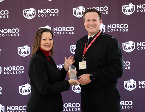 Awardee Captain Burgon from NSWC with President Green