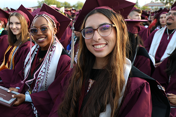 Norco College graduates smiling at Commencement