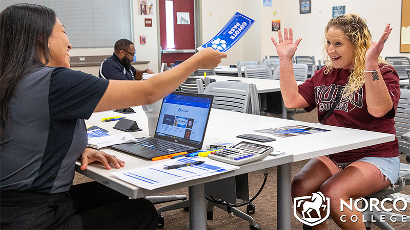 A student receiving her instant admit ticket. A student receiving her instant admit ticket.
