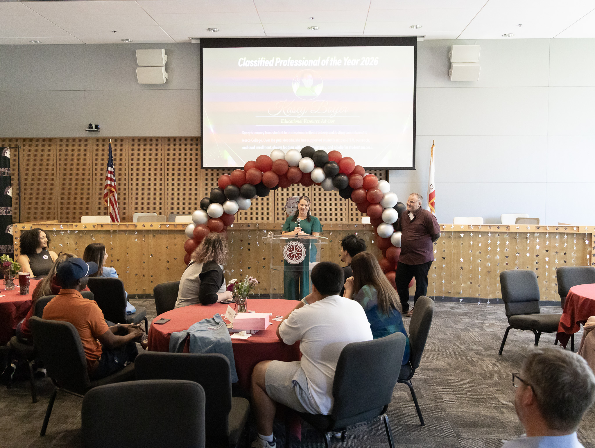 Kasey Boyer accepting the award for Classified Professional of the Year.