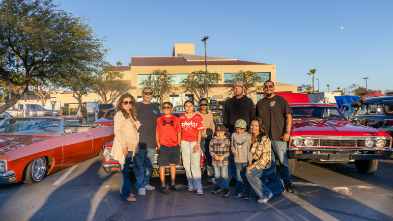 Lowrider Show car builder Richard with his family and their three cars