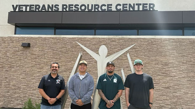 Norco College Veterans Services Coordinator Eric Betancourt (left) with veteran scholarship winners