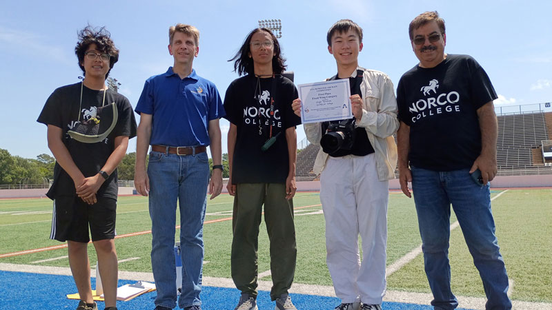 Norco College Engineering Students and Professor Khosrow Rad at the University of Texas at Arlington football field