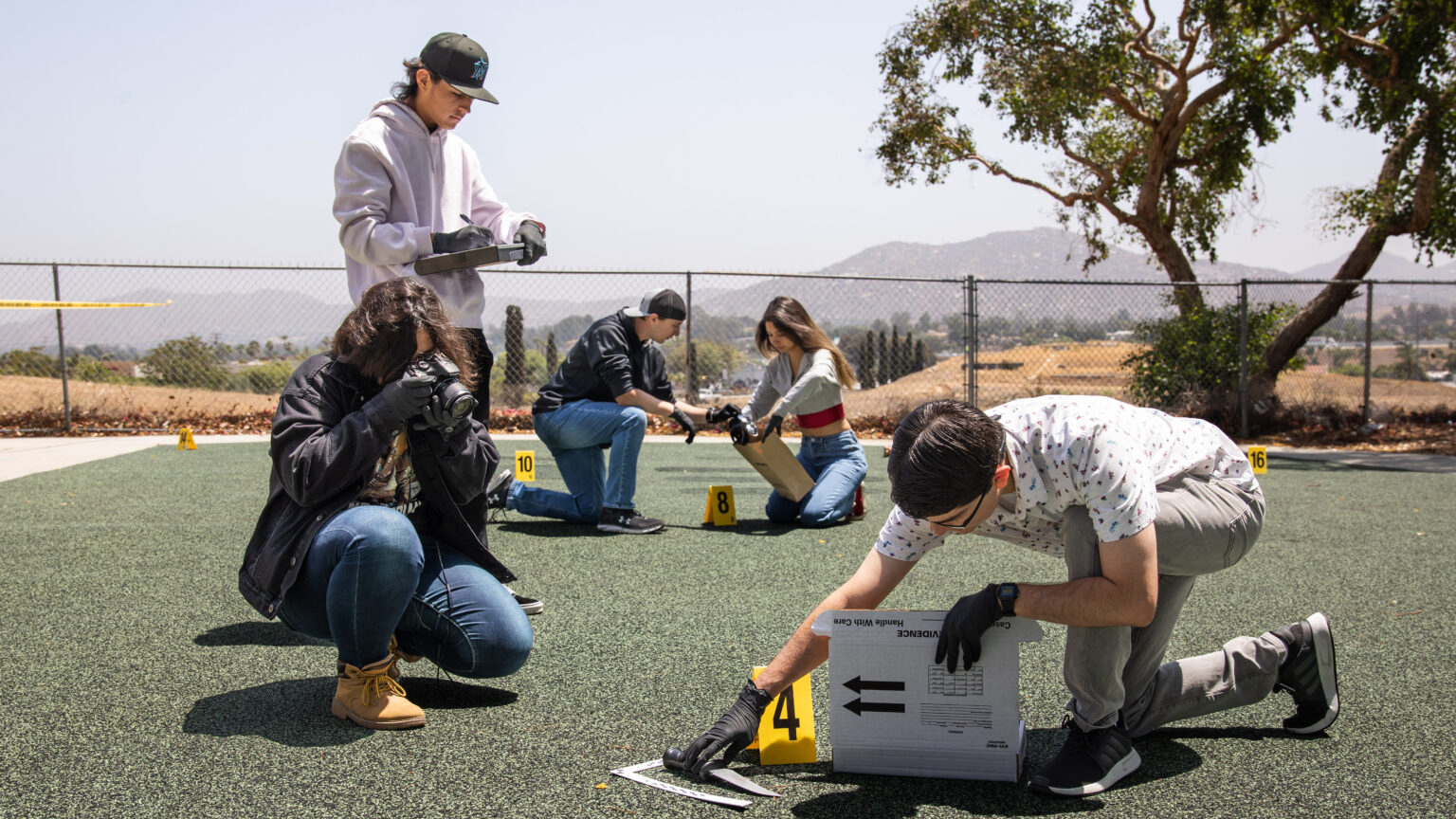 Norco College Forensic/Crime Scene Photo students learning at a mock crime scene.