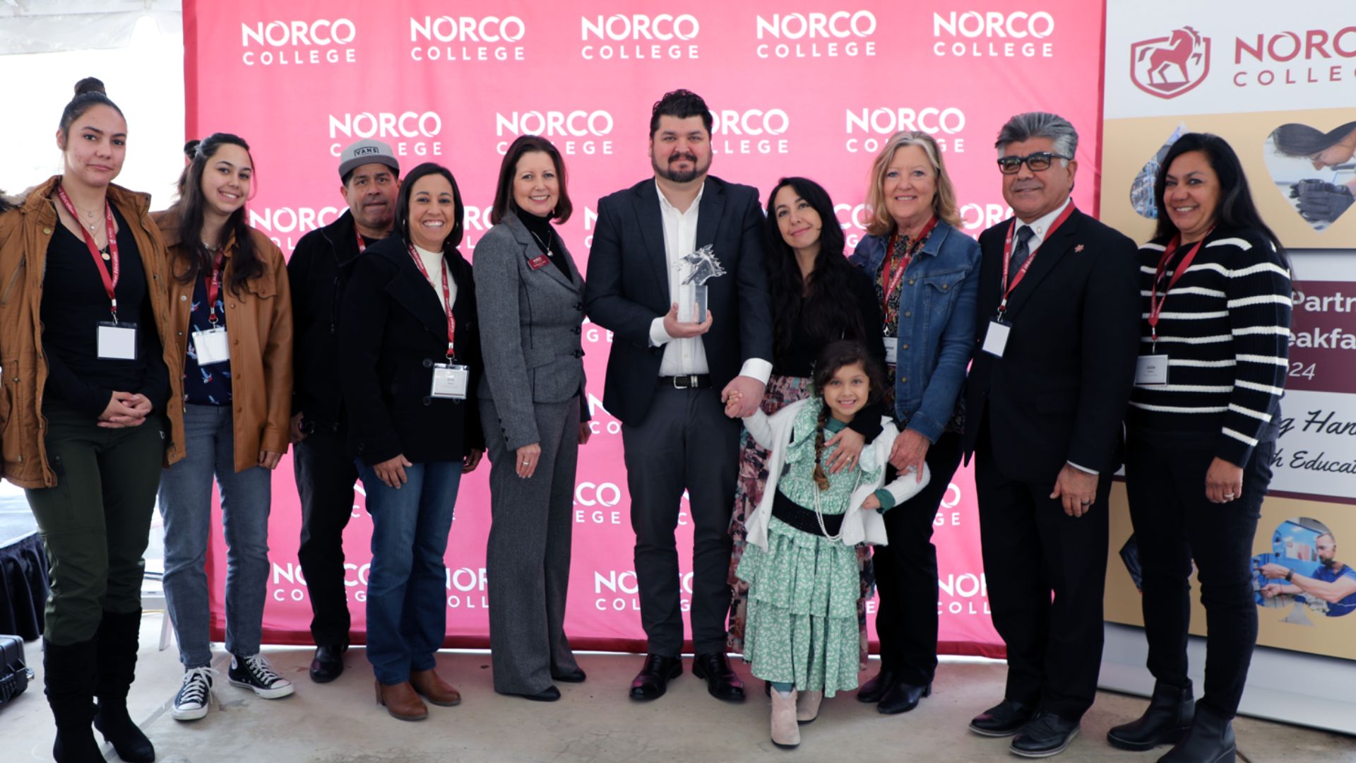 Norco College 2024 Alumnus of the Year award recipient Dr. Dariush Seif with family and Norco College President Dr. Monica Green