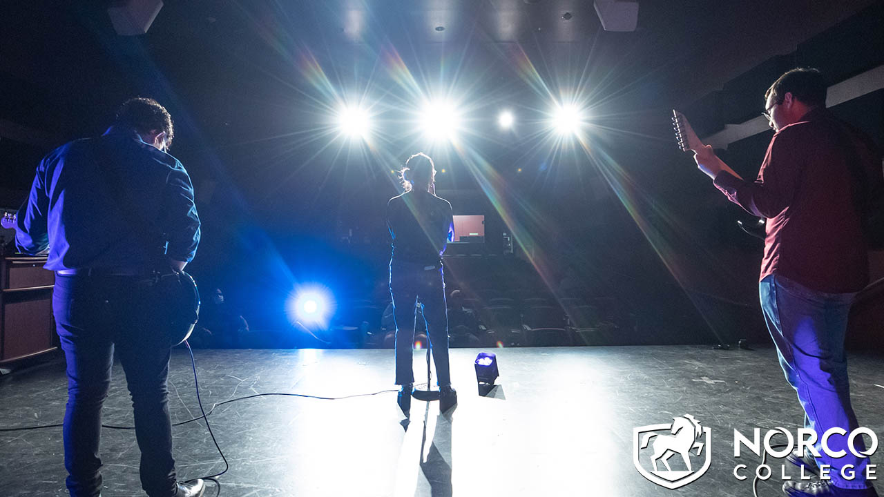 Students on Little Theatre stage 