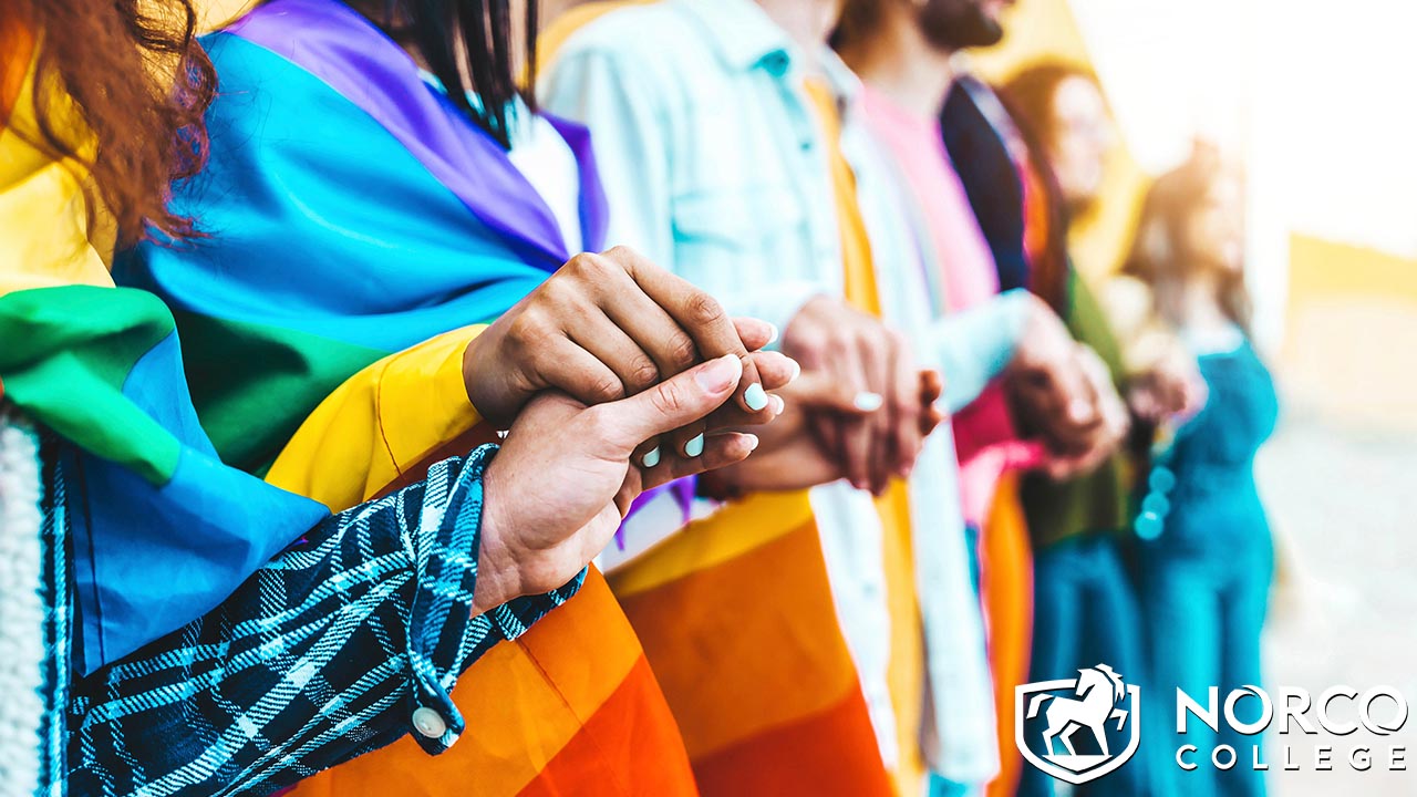 LGBTQ+ students holding hands 