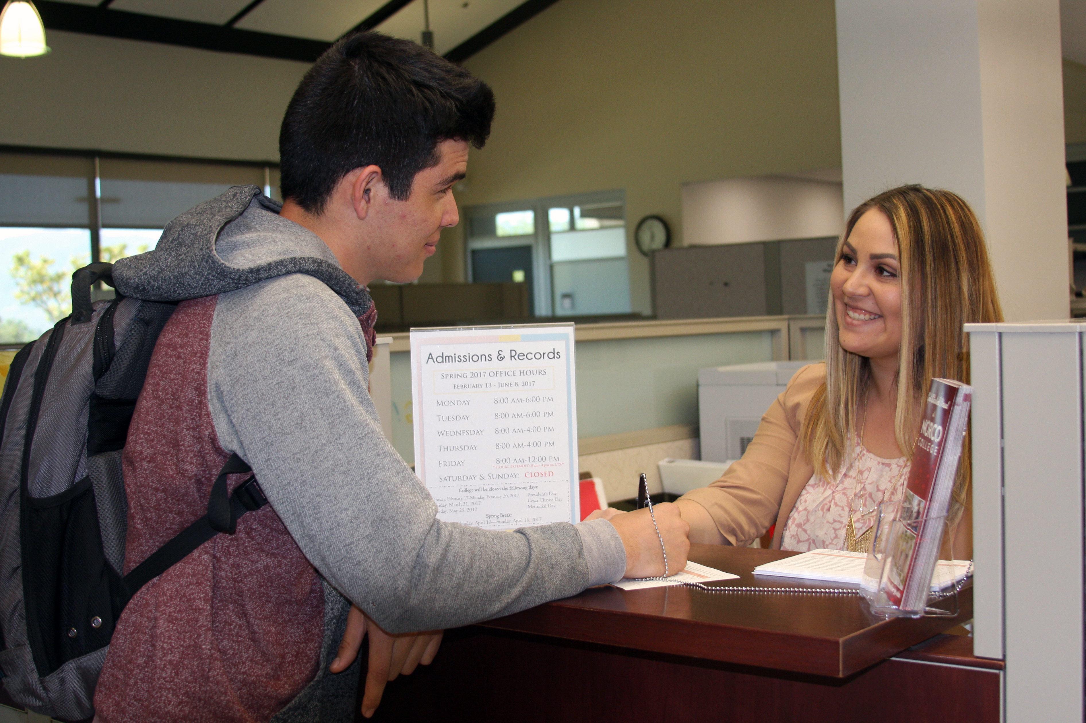 Student speaking to Norco College Admissions and Records clerk